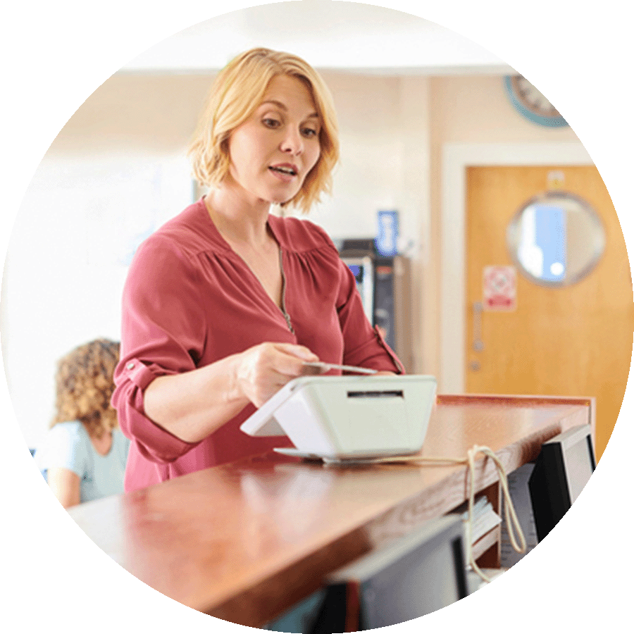Patient making a payment at the doctors office counter