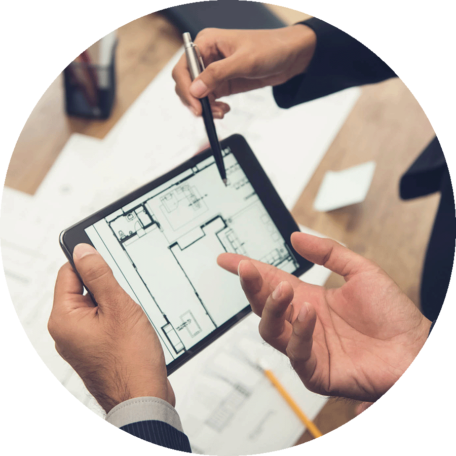 Businessmen looking at ipad at commercial real estate