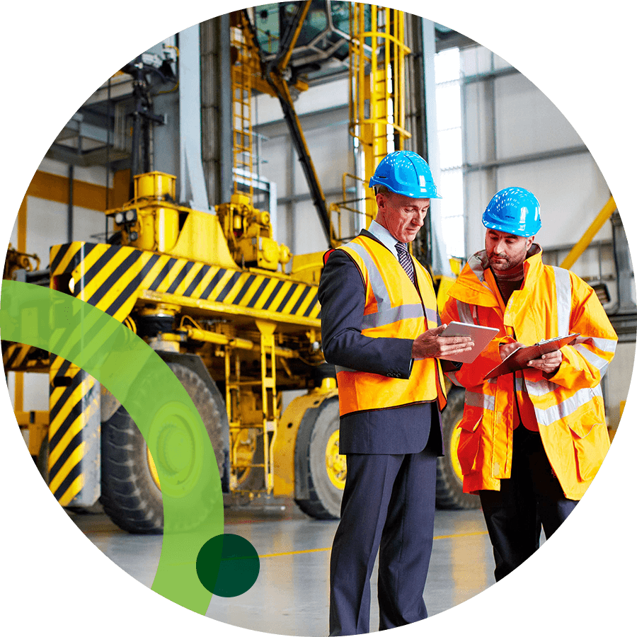 Construction workers in a large building with equipement