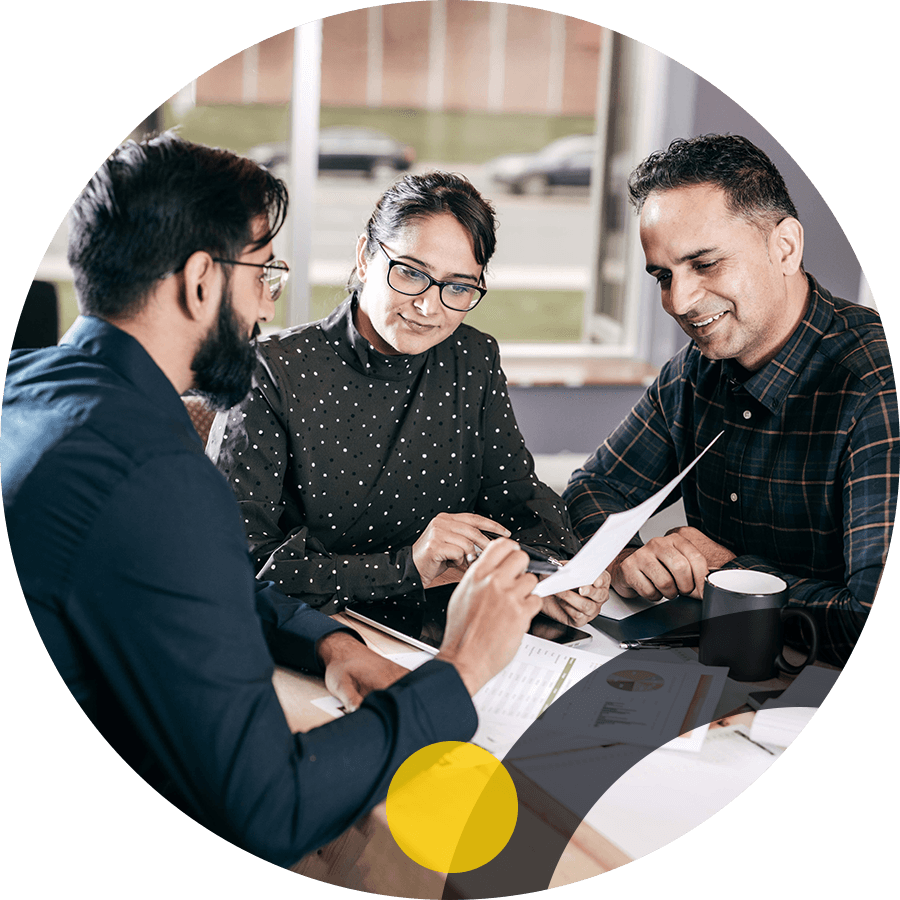 Business people sitting at a table reviewing documents