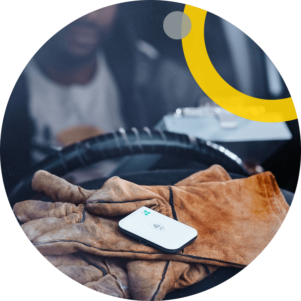 Construction worker at job site paying with Clover