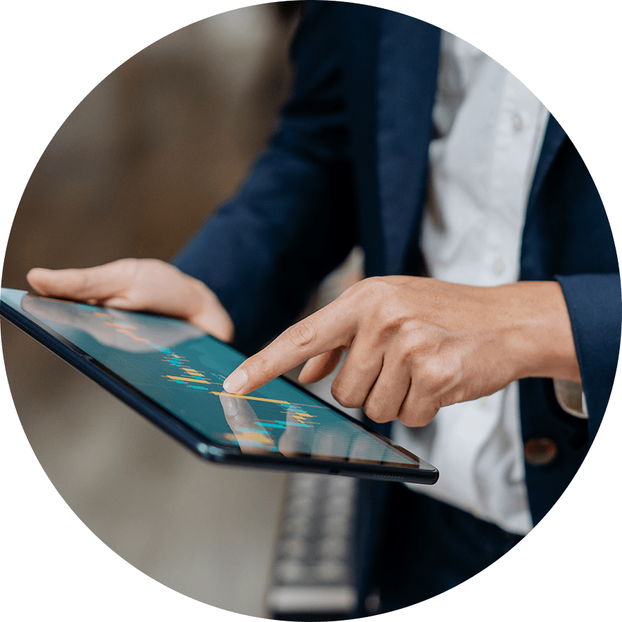 Businessman looking at trade chart on his tablet