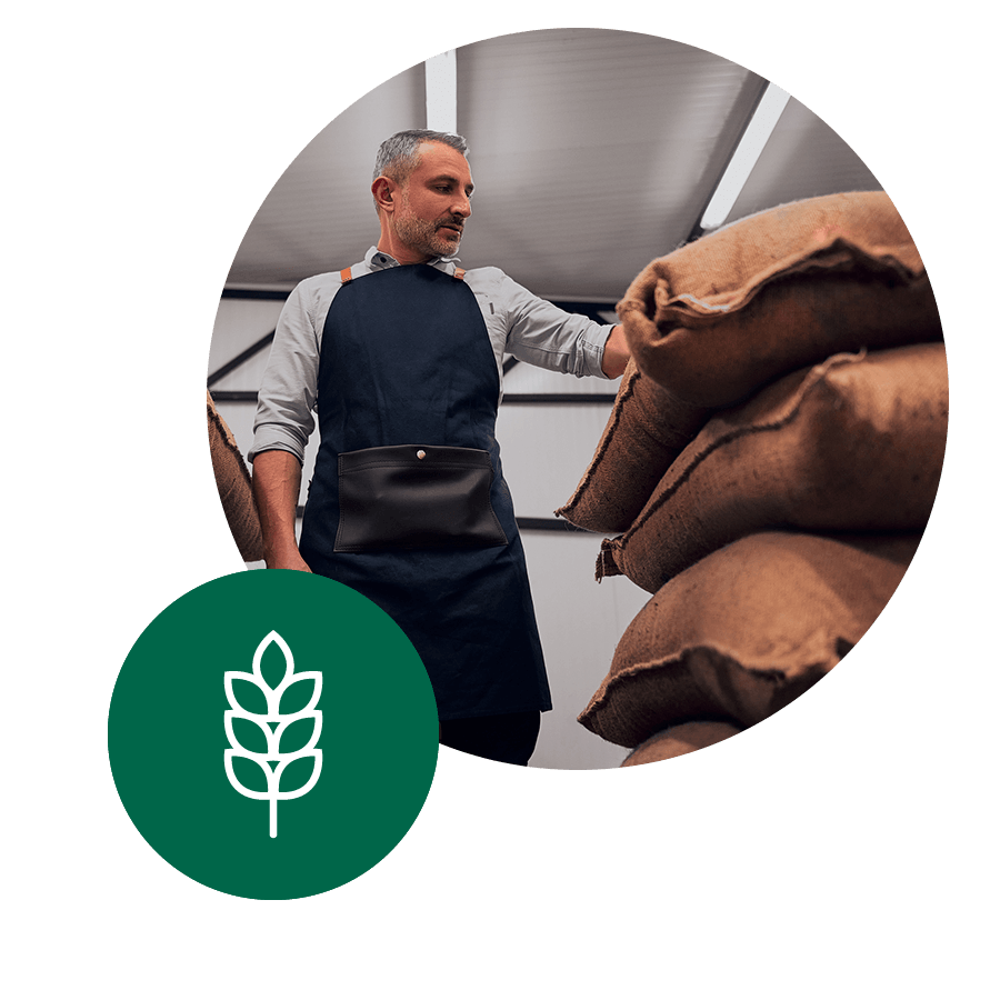 Farmer with bags of grain