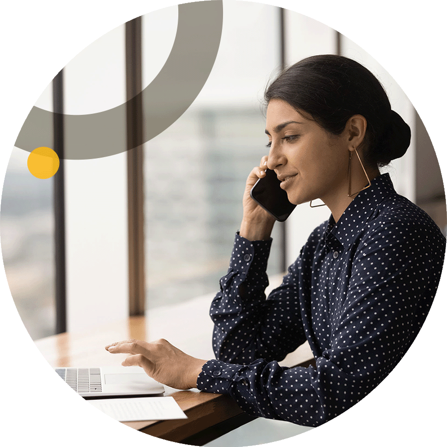 Business woman on the phone using computer