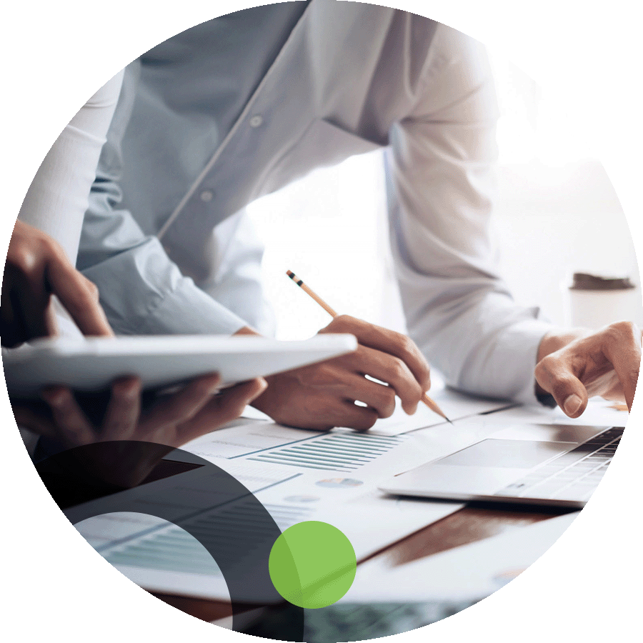 Business people inputting data into a computer