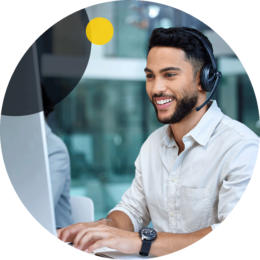 Businessman using call help center while using desktop