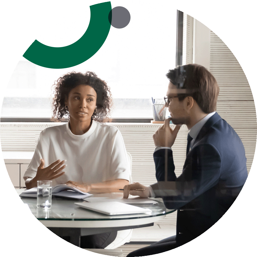 Business woman and man meeting at a conference table