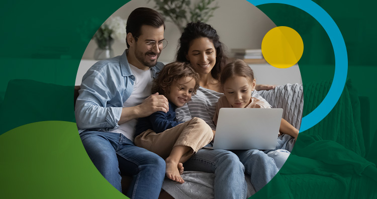 Family sitting together looking at a tablet.