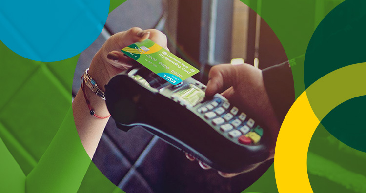 A person paying using debit card.