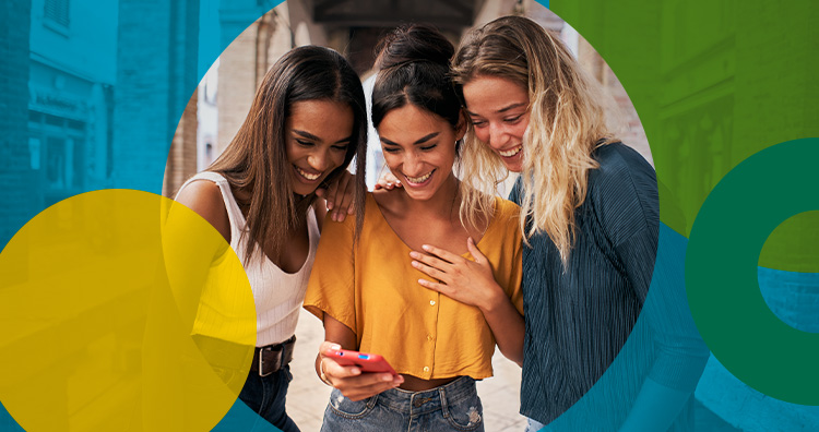 Friends looking at a phone together