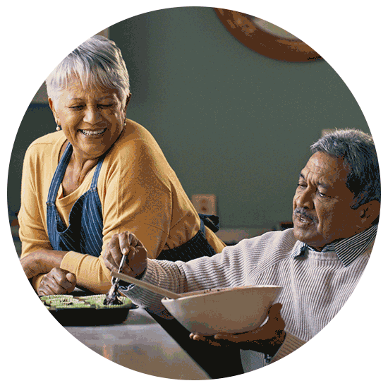 Couple enjoys time together as they cook.
