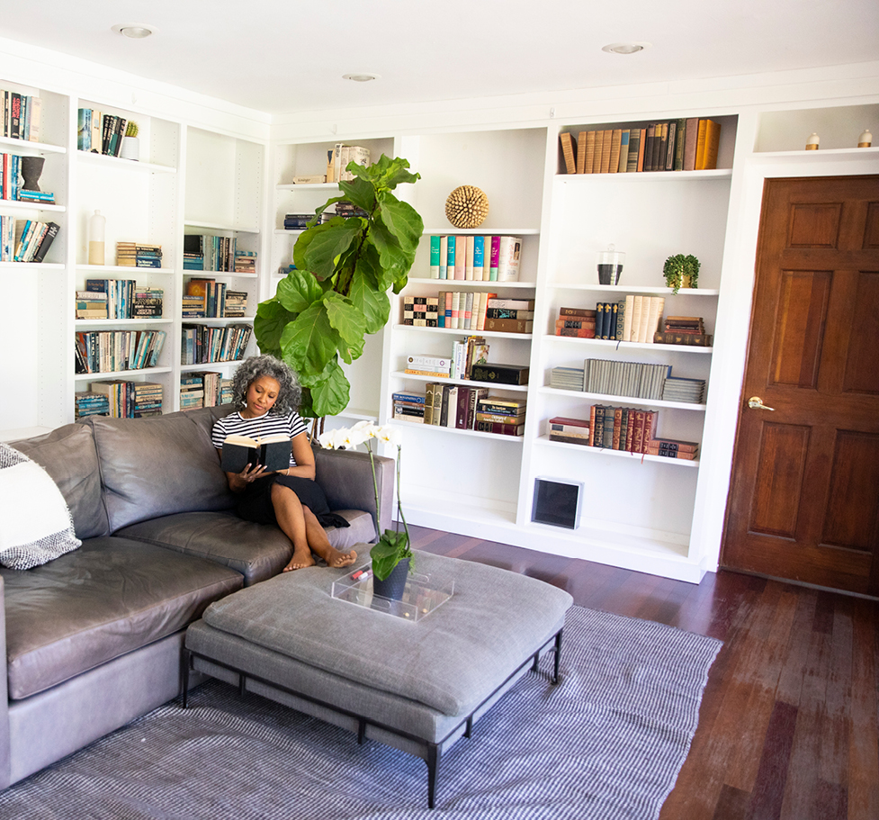 Woman relaxing at home and reading a book