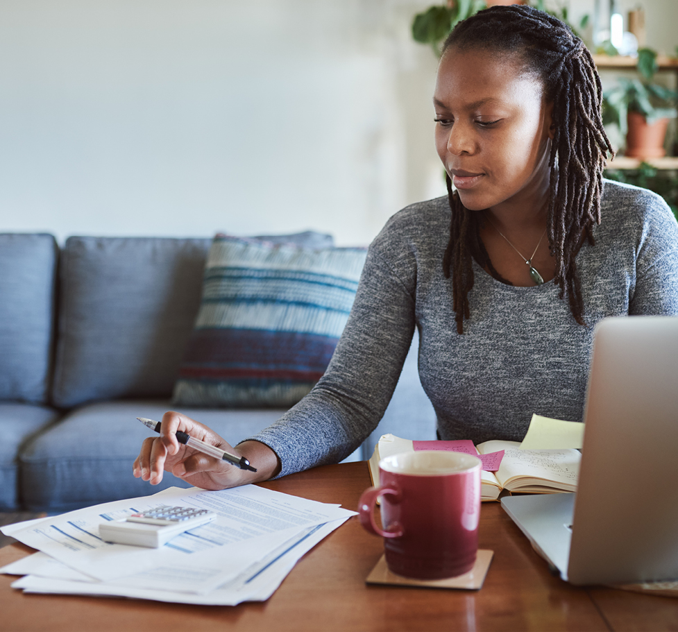 Woman calculating the cost of renovating her home.