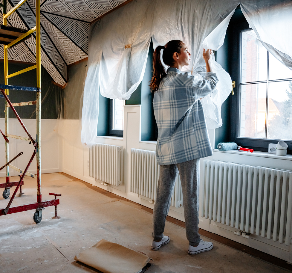 Woman renovating her home.